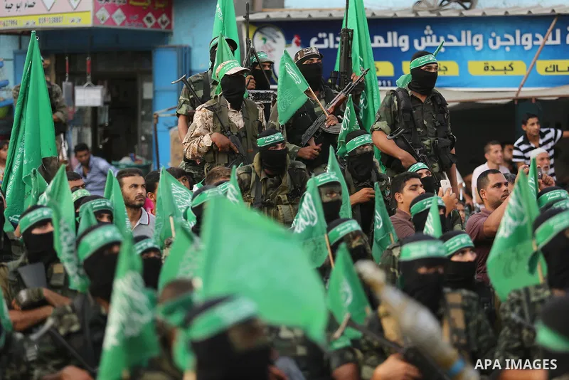 Palestinian Hamas militants take part in a military show against Israel's newly-installed security measures at the entrance to the al-Aqsa mosque compound, in Khan Younis, in the southern Gaza Strip July 20, 2017. Photo...