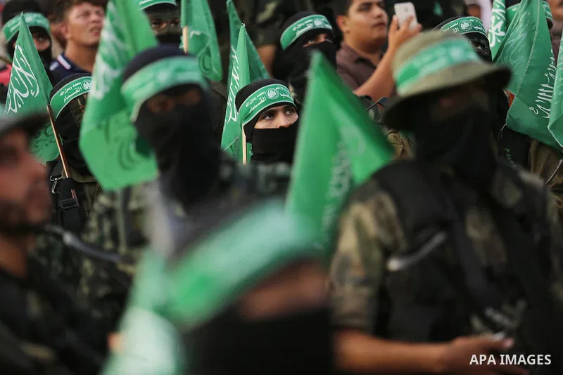 Palestinian Hamas militants take part in a military show against Israel's newly-installed security measures at the entrance to the al-Aqsa mosque compound, in Khan Younis, in the southern Gaza Strip July 20, 2017. Photo...