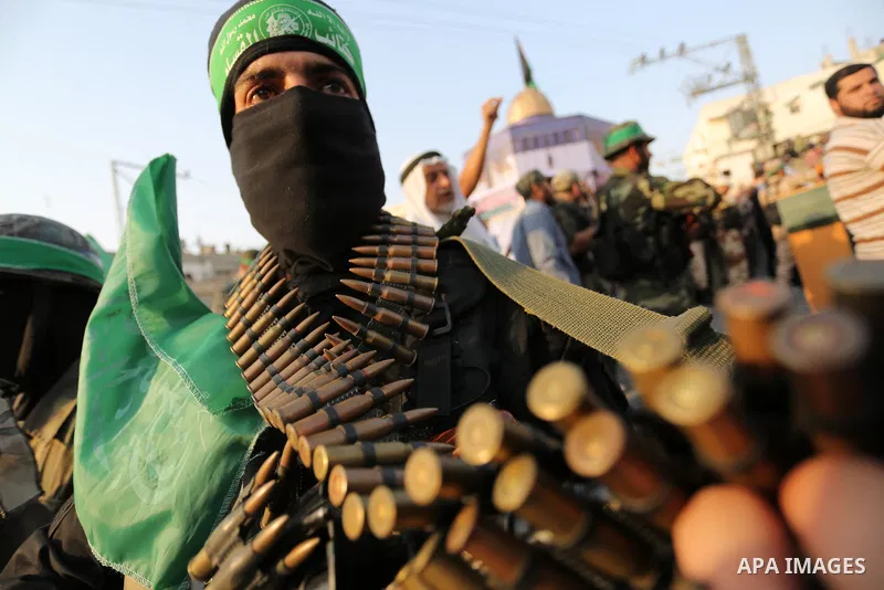 Palestinian Hamas militants take part in a military show against Israel's newly-installed security measures at the entrance to the al-Aqsa mosque compound, in Khan Younis, in the southern Gaza Strip July 20, 2017. Photo...