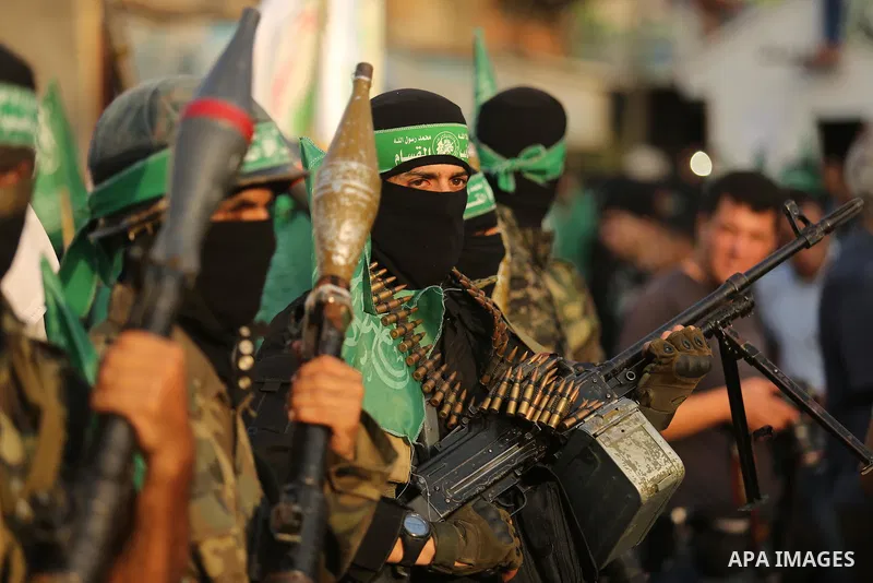 Palestinian Hamas militants take part in a military show against Israel's newly-installed security measures at the entrance to the al-Aqsa mosque compound, in Khan Younis, in the southern Gaza Strip July 20, 2017. Photo...