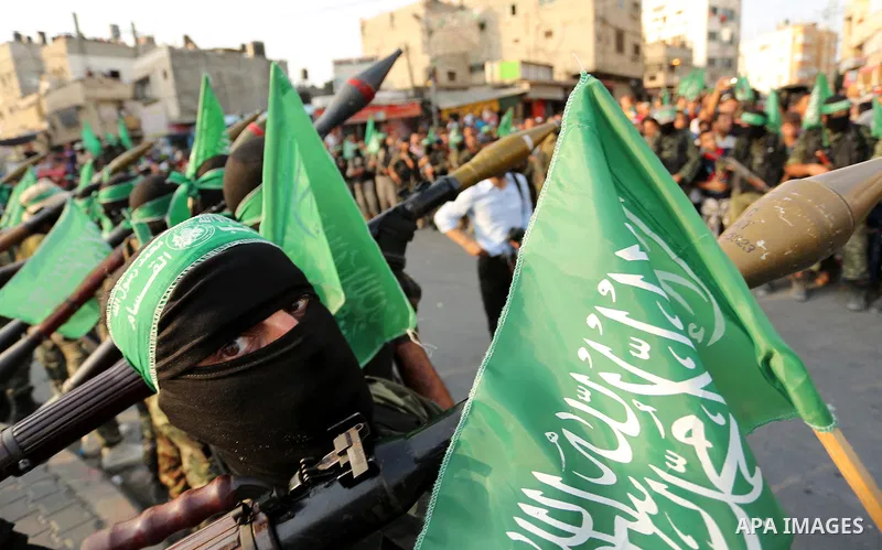 Palestinian Hamas militants take part in a military show against Israel's newly-installed security measures at the entrance to the al-Aqsa mosque compound, in Khan Younis, in the southern Gaza Strip July 20, 2017. Photo...
