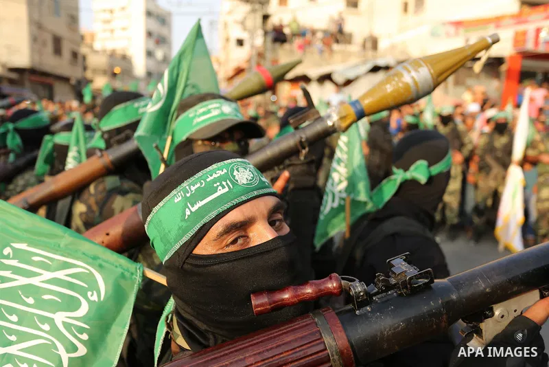 Palestinian Hamas militants take part in a military show against Israel's newly-installed security measures at the entrance to the al-Aqsa mosque compound, in Khan Younis, in the southern Gaza Strip July 20, 2017. Photo...