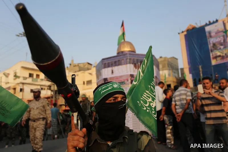 Palestinian Hamas militants take part in a military show against Israel's newly-installed security measures at the entrance to the al-Aqsa mosque compound, in Khan Younis, in the southern Gaza Strip July 20, 2017. Photo...