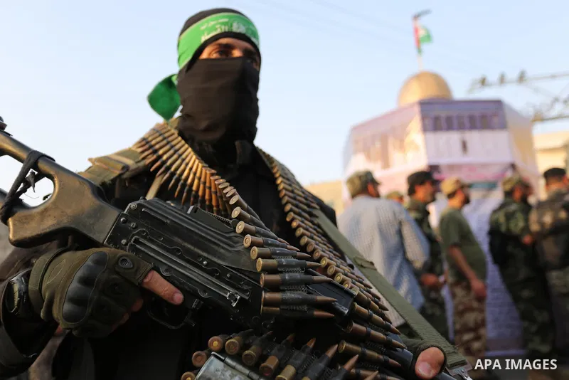 Palestinian Hamas militants take part in a military show against Israel's newly-installed security measures at the entrance to the al-Aqsa mosque compound, in Khan Younis, in the southern Gaza Strip July 20, 2017. Photo...