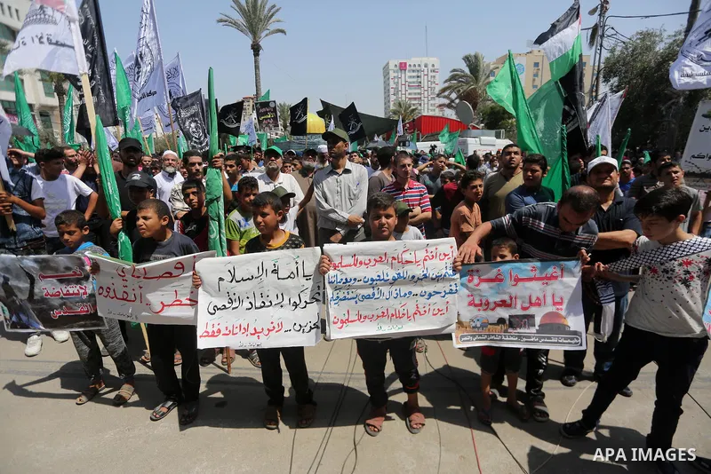 Palestinian demonstrators take part during a protest against Israel's new security measures at the entrance to the al-Aqsa mosque compound, which include metal detectors and cameras, in Gaza City on July 21, 2017. Photo...
