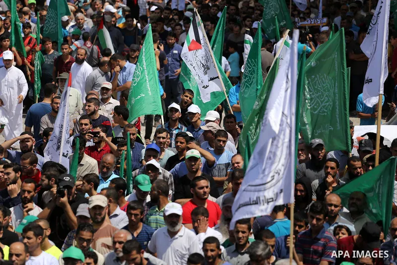 Palestinian demonstrators take part during a protest against Israel's new security measures at the entrance to the al-Aqsa mosque compound, which include metal detectors and cameras, in Gaza City on July 21, 2017. Photo...