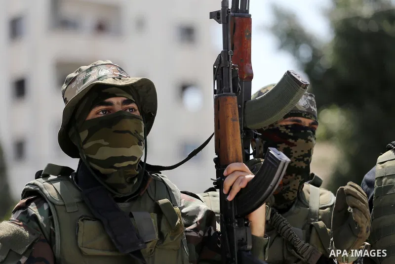 Palestinian Hamas militants take part in a protest against Israel's new security measures at the entrance to the al-Aqsa mosque compound, which include metal detectors and cameras, in Gaza City on July 21, 2017. Photo by...