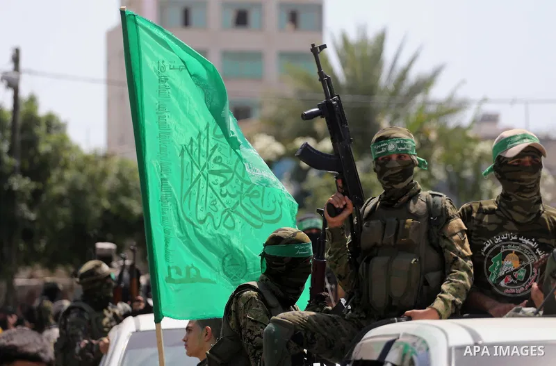 Palestinian Hamas militants take part in a protest against Israel's new security measures at the entrance to the al-Aqsa mosque compound, which include metal detectors and cameras, in Gaza City on July 21, 2017. Photo by...