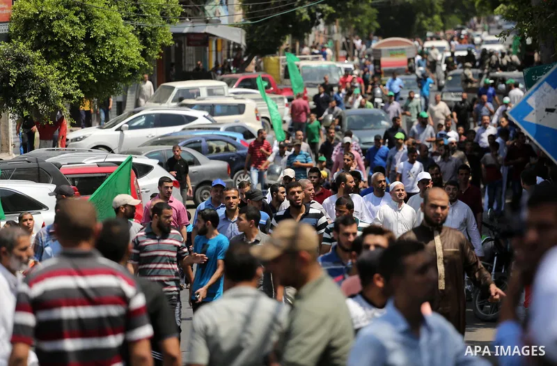 Palestinian demonstrators take part during a protest against Israel's new security measures at the entrance to the al-Aqsa mosque compound, which include metal detectors and cameras, in Gaza City on July 21, 2017. Photo...
