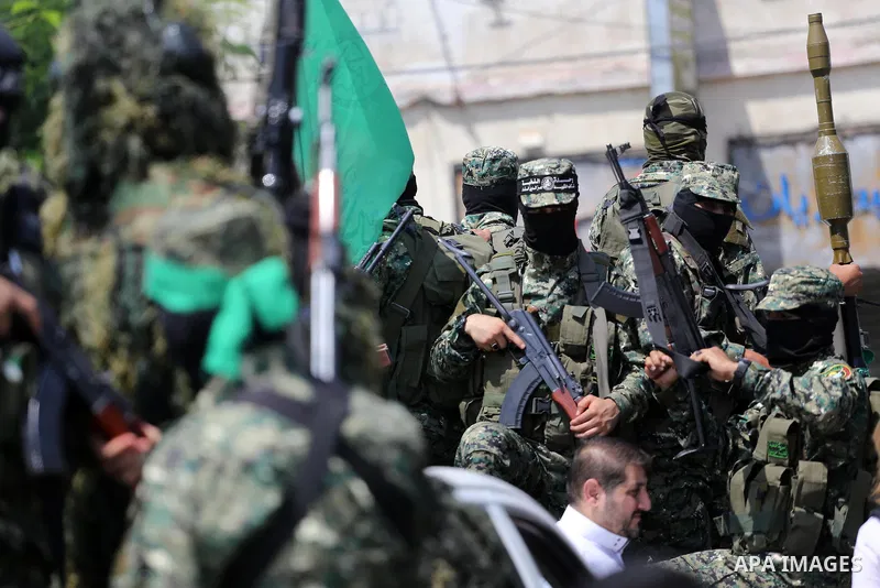 Palestinian Hamas militants take part in a protest against Israel's new security measures at the entrance to the al-Aqsa mosque compound, which include metal detectors and cameras, in Gaza City on July 21, 2017. Photo by...