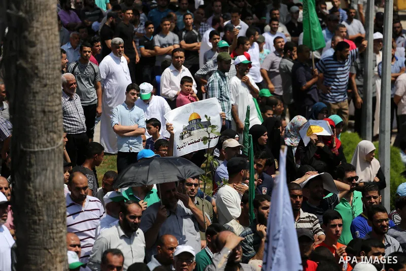 Palestinian demonstrators take part during a protest against Israel's new security measures at the entrance to the al-Aqsa mosque compound, which include metal detectors and cameras, in Gaza City on July 21, 2017. Photo...