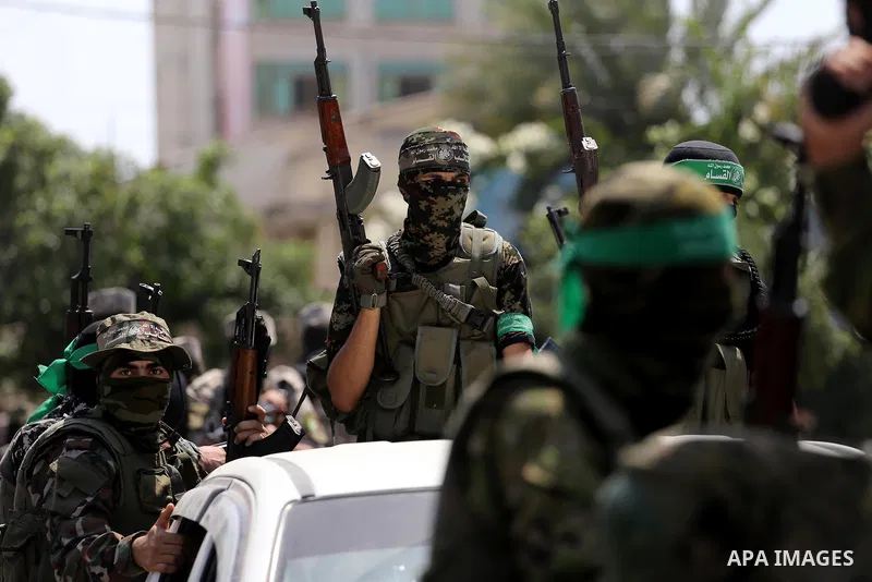 Palestinian Hamas militants take part in a protest against Israel's new security measures at the entrance to the al-Aqsa mosque compound, which include metal detectors and cameras, in Gaza City on July 21, 2017. Photo by...
