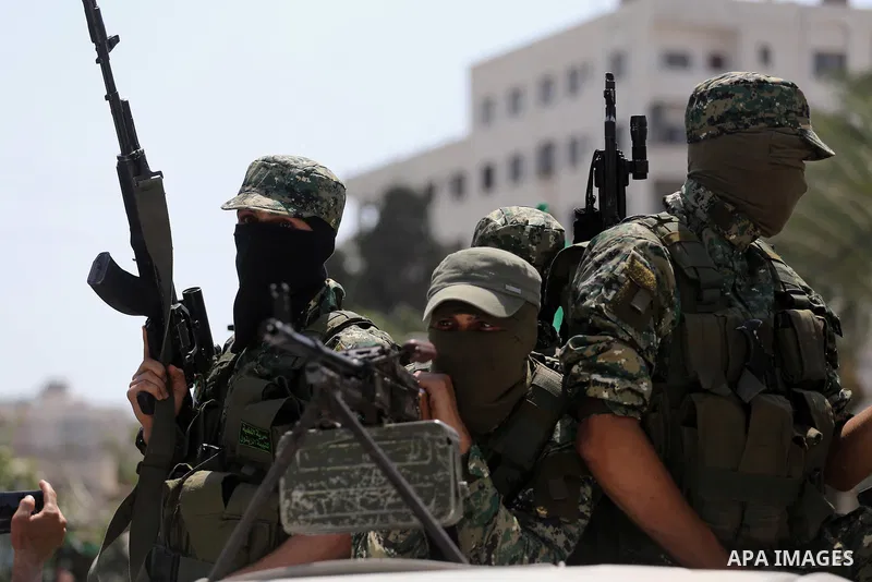 Palestinian Hamas militants take part in a protest against Israel's new security measures at the entrance to the al-Aqsa mosque compound, which include metal detectors and cameras, in Gaza City on July 21, 2017. Photo by...
