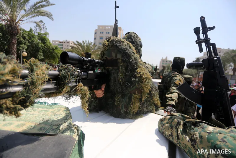 Palestinian Hamas militants take part in a protest against Israel's new security measures at the entrance to the al-Aqsa mosque compound, which include metal detectors and cameras, in Gaza City on July 21, 2017. Photo by...