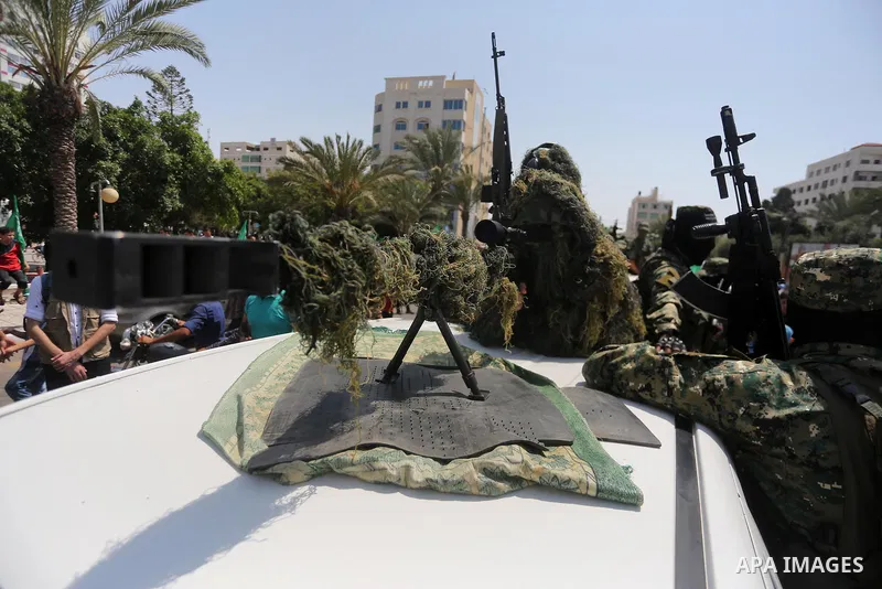 Palestinian Hamas militants take part in a protest against Israel's new security measures at the entrance to the al-Aqsa mosque compound, which include metal detectors and cameras, in Gaza City on July 21, 2017. Photo by...