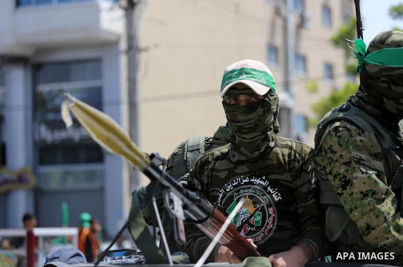 Palestinian Hamas militants take part in a protest against Israel's new security measures at the entrance to the al-Aqsa mosque compound, which include metal detectors and cameras, in Gaza City on July 21, 2017. Photo by...