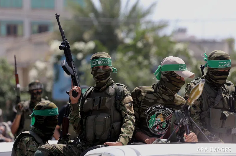 Palestinian Hamas militants take part in a protest against Israel's new security measures at the entrance to the al-Aqsa mosque compound, which include metal detectors and cameras, in Gaza City on July 21, 2017. Photo by...