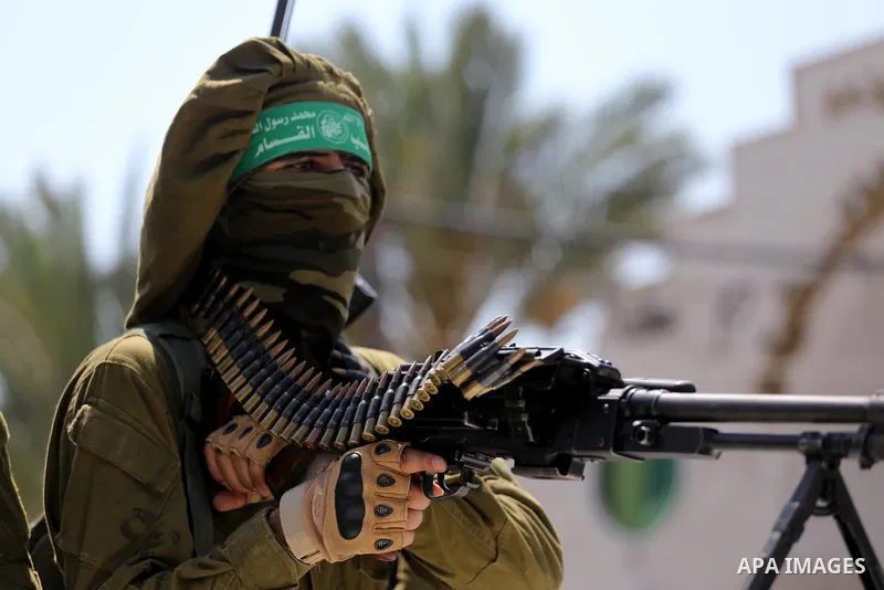 Palestinian Hamas militants take part in a protest against Israel's new security measures at the entrance to the al-Aqsa mosque compound, which include metal detectors and cameras, in Gaza City on July 21, 2017. Photo by...