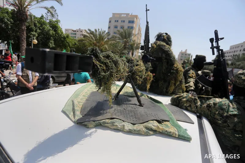 Palestinian Hamas militants take part in a protest against Israel's new security measures at the entrance to the al-Aqsa mosque compound, which include metal detectors and cameras, in Gaza City on July 21, 2017. Photo by...