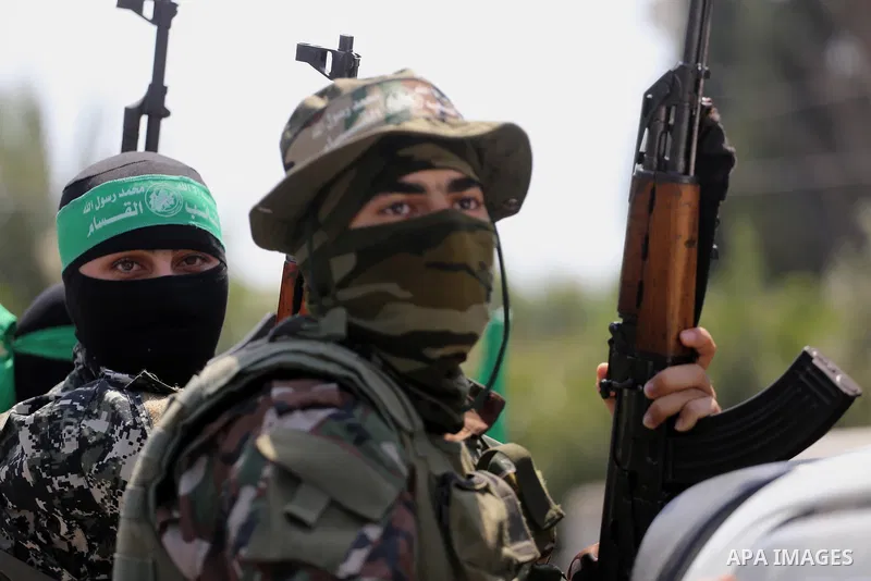 Palestinian Hamas militants take part in a protest against Israel's new security measures at the entrance to the al-Aqsa mosque compound, which include metal detectors and cameras, in Gaza City on July 21, 2017. Photo by...