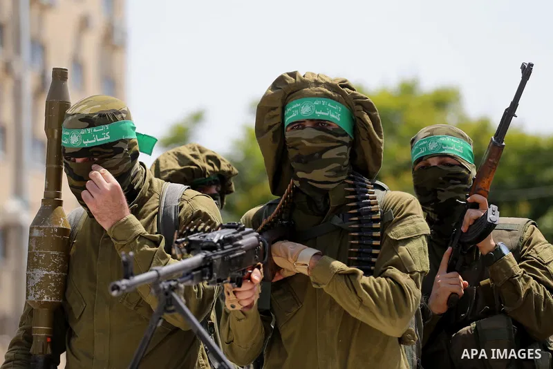 Palestinian Hamas militants take part in a protest against Israel's new security measures at the entrance to the al-Aqsa mosque compound, which include metal detectors and cameras, in Gaza City on July 21, 2017. Photo by...