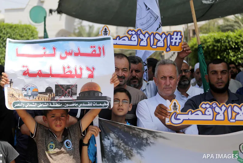 Palestinian demonstrators take part during a protest against Israel's new security measures at the entrance to the al-Aqsa mosque compound, which include metal detectors and cameras, in Gaza City on July 21, 2017. Photo...