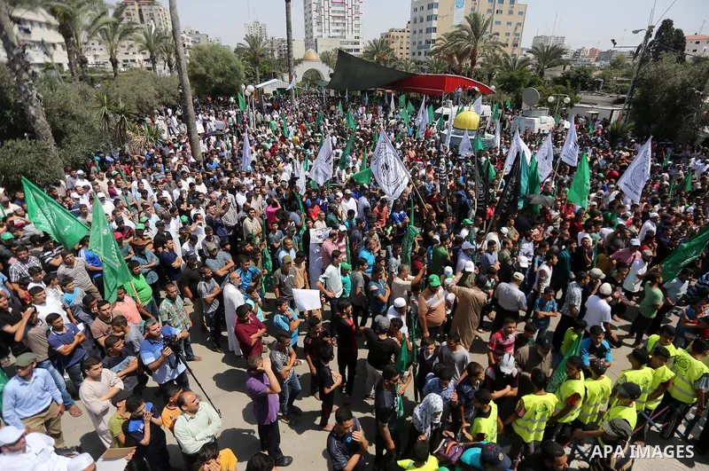 Palestinian demonstrators take part during a protest against Israel's new security measures at the entrance to the al-Aqsa mosque compound, which include metal detectors and cameras, in Gaza City on July 21, 2017. Photo...