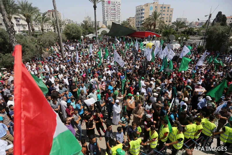 Palestinian demonstrators take part during a protest against Israel's new security measures at the entrance to the al-Aqsa mosque compound, which include metal detectors and cameras, in Gaza City on July 21, 2017. Photo...