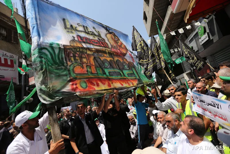 Palestinian demonstrators take part in a protest against Israel's new security measures at the entrance to the al-Aqsa mosque compound, which include metal detectors and cameras, in Khan Younis in the the southern Gaza s...