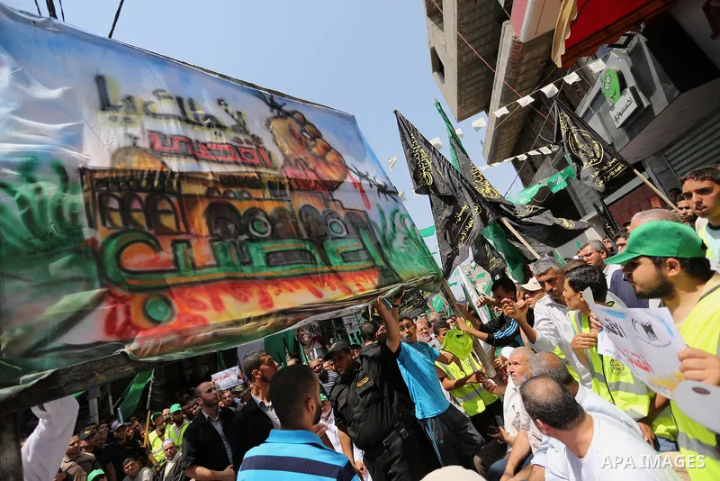 Palestinian demonstrators take part in a protest against Israel's new security measures at the entrance to the al-Aqsa mosque compound, which include metal detectors and cameras, in Khan Younis in the the southern Gaza s...