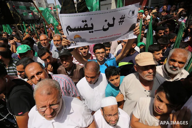 Palestinian demonstrators take part in a protest against Israel's new security measures at the entrance to the al-Aqsa mosque compound, which include metal detectors and cameras, in Khan Younis in the the southern Gaza s...