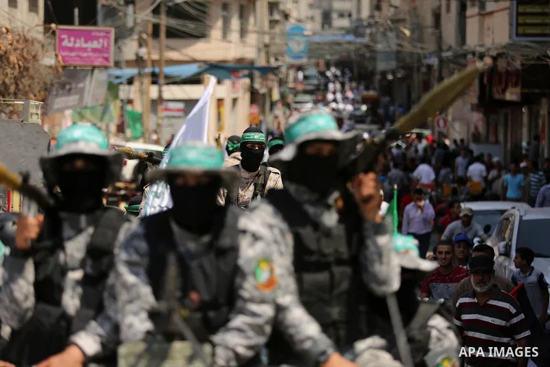 Palestinian Hamas militants take part in a protest against Israel's new security measures at the entrance to the al-Aqsa mosque compound, which include metal detectors and cameras, in Khan Younis in the the southern Gaza...