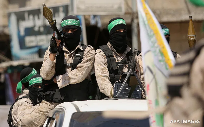 Palestinian Hamas militants take part in a protest against Israel's new security measures at the entrance to the al-Aqsa mosque compound, which include metal detectors and cameras, in Khan Younis in the the southern Gaza...