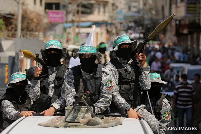 Palestinian Hamas militants take part in a protest against Israel's new security measures at the entrance to the al-Aqsa mosque compound, which include metal detectors and cameras, in Khan Younis in the the southern Gaza...