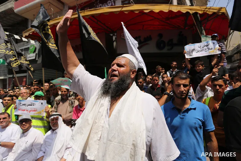 Palestinian demonstrators take part in a protest against Israel's new security measures at the entrance to the al-Aqsa mosque compound, which include metal detectors and cameras, in Khan Younis in the the southern Gaza s...