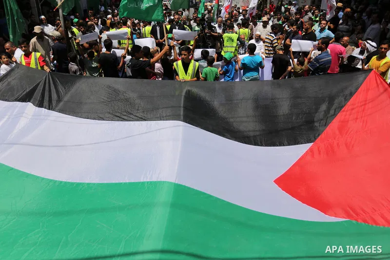 Palestinian demonstrators take part in a protest against Israel's new security measures at the entrance to the al-Aqsa mosque compound, which include metal detectors and cameras, in Khan Younis in the the southern Gaza s...