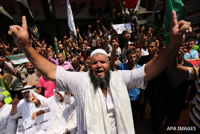 Palestinian demonstrators take part in a protest against Israel's new security measures at the entrance to the al-Aqsa mosque compound, which include metal detectors and cameras, in Khan Younis in the the southern Gaza s...