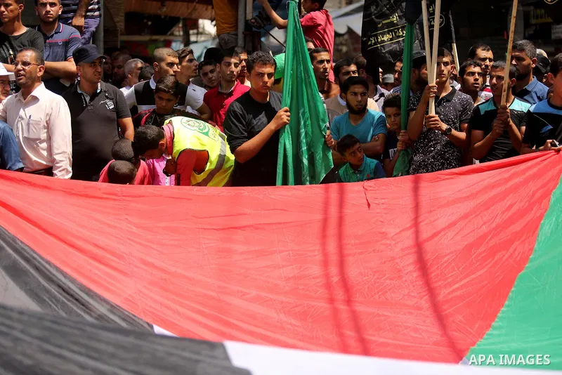 Palestinian demonstrators take part in a protest against Israel's new security measures at the entrance to the al-Aqsa mosque compound, which include metal detectors and cameras, in Khan Younis in the the southern Gaza s...