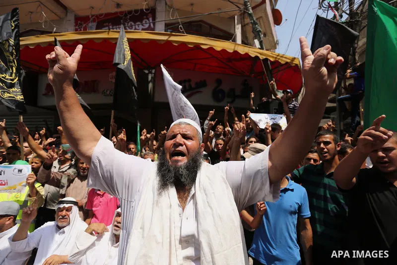 Palestinian demonstrators take part in a protest against Israel's new security measures at the entrance to the al-Aqsa mosque compound, which include metal detectors and cameras, in Khan Younis in the the southern Gaza s...