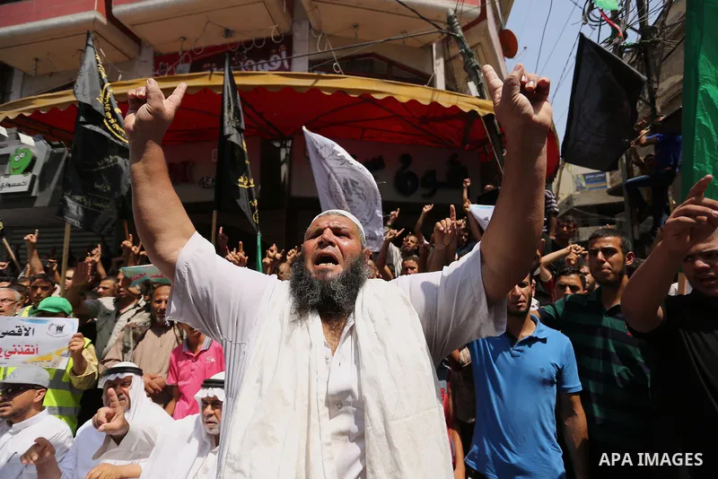 Palestinian demonstrators take part in a protest against Israel's new security measures at the entrance to the al-Aqsa mosque compound, which include metal detectors and cameras, in Khan Younis in the the southern Gaza s...
