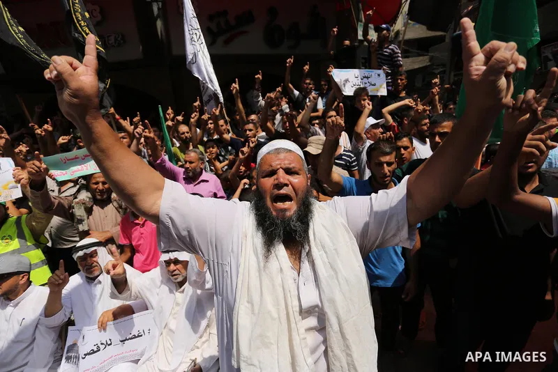 Palestinian demonstrators take part in a protest against Israel's new security measures at the entrance to the al-Aqsa mosque compound, which include metal detectors and cameras, in Khan Younis in the the southern Gaza s...