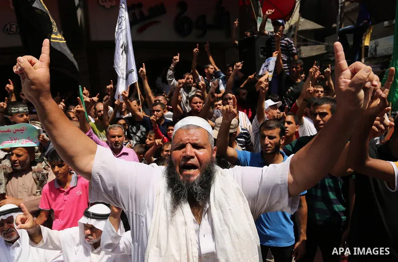 Palestinian demonstrators take part in a protest against Israel's new security measures at the entrance to the al-Aqsa mosque compound, which include metal detectors and cameras, in Khan Younis in the the southern Gaza s...