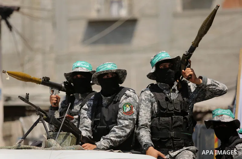 Palestinian Hamas militants take part in a protest against Israel's new security measures at the entrance to the al-Aqsa mosque compound, which include metal detectors and cameras, in Khan Younis in the the southern Gaza...