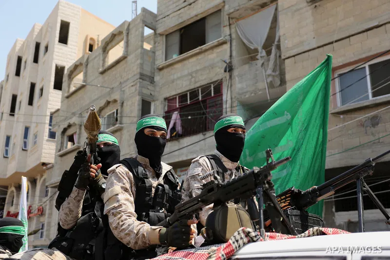 Palestinian Hamas militants take part in a protest against Israel's new security measures at the entrance to the al-Aqsa mosque compound, which include metal detectors and cameras, in Khan Younis in the the southern Gaza...