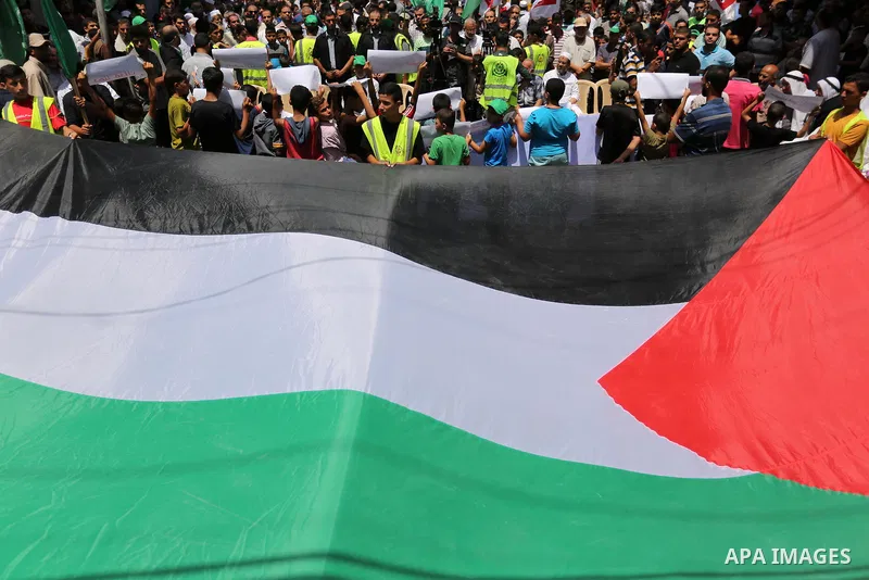 Palestinian demonstrators take part in a protest against Israel's new security measures at the entrance to the al-Aqsa mosque compound, which include metal detectors and cameras, in Khan Younis in the the southern Gaza s...