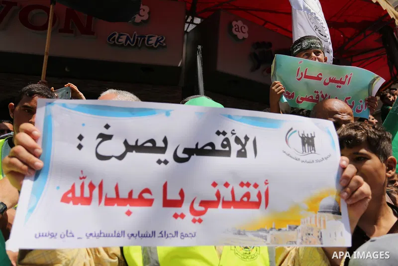Palestinian demonstrators take part in a protest against Israel's new security measures at the entrance to the al-Aqsa mosque compound, which include metal detectors and cameras, in Khan Younis in the the southern Gaza s...