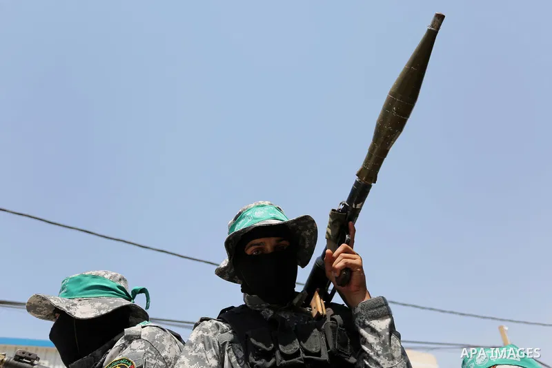 Palestinian Hamas militants take part in a protest against Israel's new security measures at the entrance to the al-Aqsa mosque compound, which include metal detectors and cameras, in Khan Younis in the the southern Gaza...