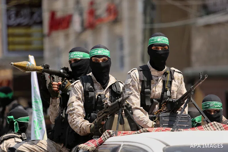 Palestinian Hamas militants take part in a protest against Israel's new security measures at the entrance to the al-Aqsa mosque compound, which include metal detectors and cameras, in Khan Younis in the the southern Gaza...