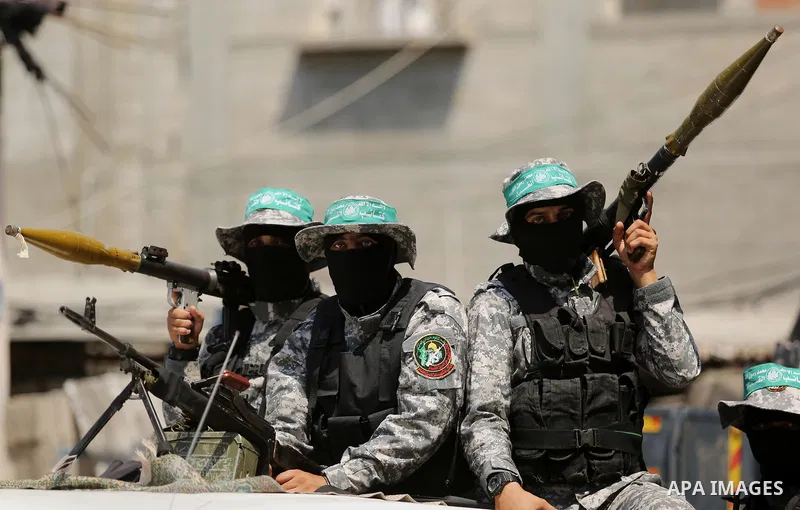 Palestinian Hamas militants take part in a protest against Israel's new security measures at the entrance to the al-Aqsa mosque compound, which include metal detectors and cameras, in Khan Younis in the the southern Gaza...