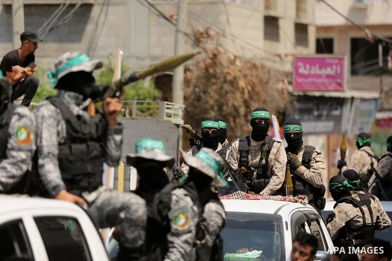 Palestinian Hamas militants take part in a protest against Israel's new security measures at the entrance to the al-Aqsa mosque compound, which include metal detectors and cameras, in Khan Younis in the the southern Gaza...